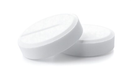 Two White Pills on White Background.