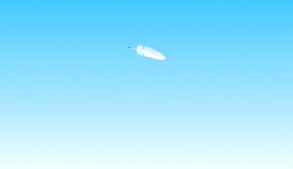 White Feather Floating in Blue Sky