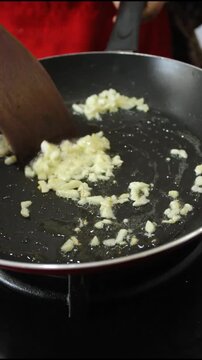 Sizzling Chopped Garlic Saut&eacute;ing in Hot Oil for Healthy Meal