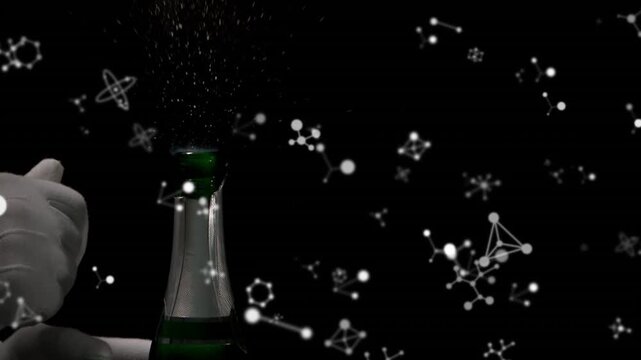 Molecular structures floating over hand popping a champagne cork against black background