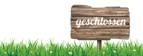Holzschild mit dem Text Geschlossen im Gras