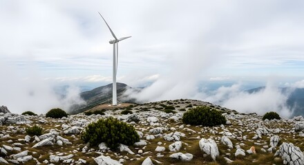 Wind turbine on a foggy mountain peak