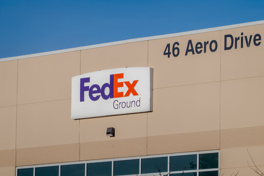 Calgary, Alberta, Canada. Jan 19, 2026. The FedEx Ground corporate logo and building address signage at a shipping and logistics facility.