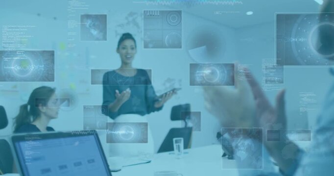 Animation of digital screens with data moving over diverse businesspeople during presentation