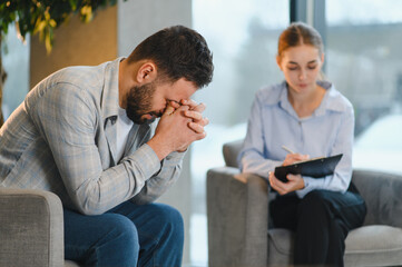 Fototapeta premium Man receiving counseling, discussing mental health issues