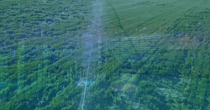 Animation of digital data and graphs overlaying lush green agricultural landscape