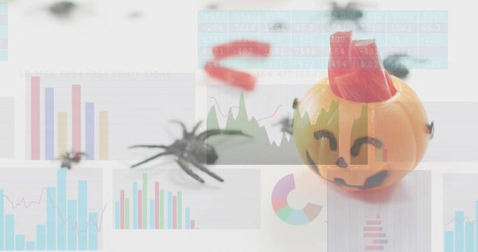 Charts shifting and morphing data causing spider stirring and crawling toward pumpkin candy holder