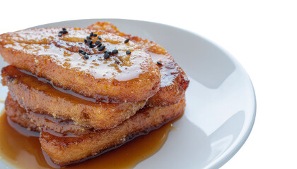 Stack of french toast with visible syrup and topping on a white plate, against a white background object on white and png