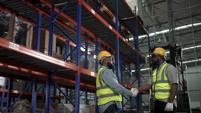 Blue collar workers are working at warehouse. Logistics, transportation.
