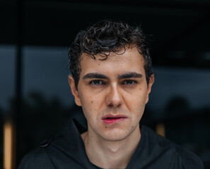Fototapeta premium Caucasian young adult male with wet hair and intense expression
