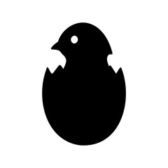 black silhouette of a bird hatching from an egg