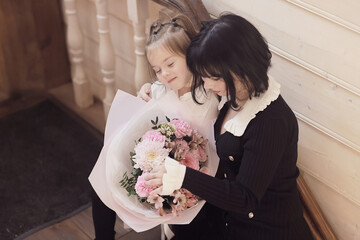 bouquet of flowers mom daughter and grandma family women's party in a cafe, Greetings to the family