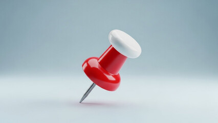 Red push pin in minimalist studio lighting on white background for office supplies