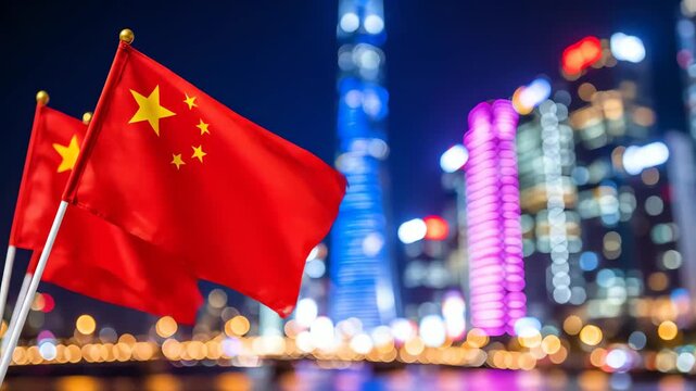 Blurred City Skyline at Night with Red Chinese Flags in the Foreground