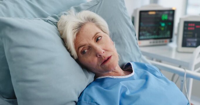 Thinking, mature woman and tired in hospital bed for recovery, post surgery and diagnosis reflection. Thoughts, female person and fatigue of medical service, healthcare operation or treatment healing