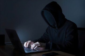 Mysterious Hooded Hacker Using Laptop &ndash; Cybersecurity and Digital Privacy Concept.