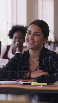 Student, education and laugh with girl in classroom for learning, knowledge and studying opportunity. Academy, future development and funny joke with person on campus for college entrance exam prep