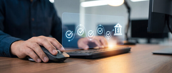 Secure banking workflow on computer with holographic checkmarks and bank icon. Business user verifying digital transactions and compliance.