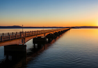 Obraz premium bridge on the lake at sunset