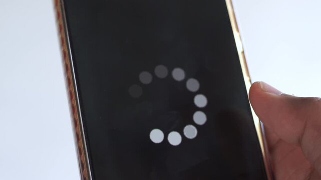 System error, slow loading, no connection to wifi on mobile smartphone screen in man hand. No signal internet connection on cellphone. System software update and upgrade loading process.