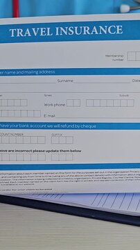 Filling out travel insurance form with personal details and bank information required for processing claims