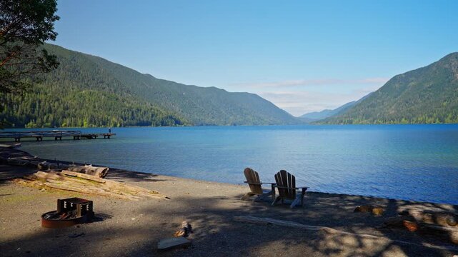 Lake Crescent in Olympic National Park, Washington, with clear blue water, forested shores, and mountain scenery. Ideal for nature, travel, and landscape footage.