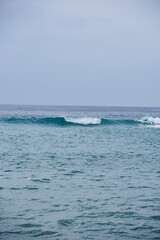 Fototapeta premium Symmetry of a Single Breaking Wave under an Overcast Sky