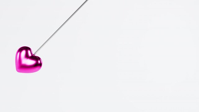 3D rendering of a pink heart pendulum swinging back and forth on white. Isolated loop.