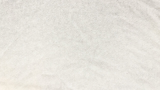 light denim texture closeup reveals subtle diagonal weave in soft pale hues ideal for minimalist wallpaper or clean banner background