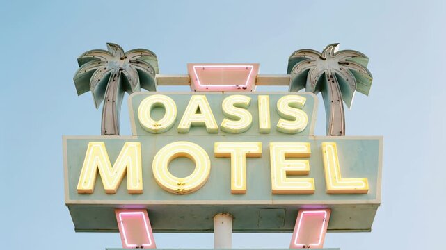 Vintage neon sign, painted in pastel hues, of the iconic Oasis Motel evokes a sense of nostalgia. The scene, shot in direct sunlight, feels classic, peaceful.