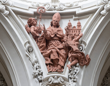 SALZBURG, AUSTRIA - SEPTEMBER 6, 2025: The baroque sculptural group of St. Augustine in the cupola of church Erhardkirche by Francesco Brenno, Carlo Antonio Brenno und Ottavio Mosto from 17. cent.