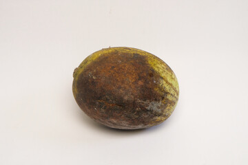 Close up of rotten mango fruit isolated on white background. Graphic design, banner and 3D rendering