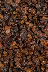 Obraz premium Close up texture of brown raisins, macro food background.