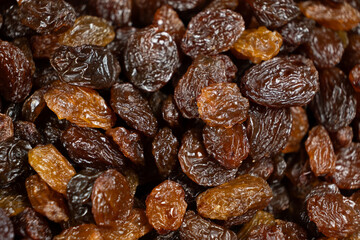 Obraz premium Macro texture of brown raisins, food background.