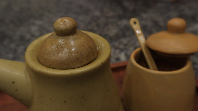 Poci is a teapot and cup made of clay. This teapot is used to serve tea with a distinctive aroma of Indonesian society.