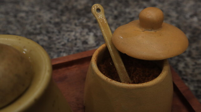 Poci is a teapot and cup made of clay. This teapot is used to serve tea with a distinctive aroma of Indonesian society.