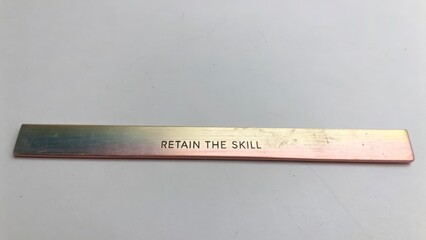 Engraved Metal Strip Reminds to Retain Skill