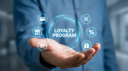 Person displaying a digital loyalty program interface with glowing icons in a modern setti