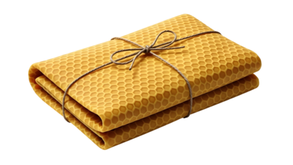 Stack of yellow fabric with honeycomb pattern tied with twine, isolated on transparent background
