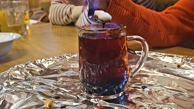 Traditional Krambambuli Preparation with Flaming Alcohol and Sugar, Ebensee, Austria