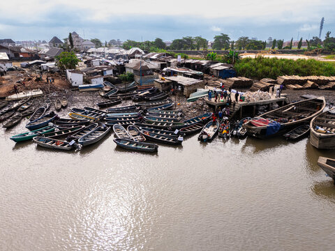Aerial view of boats resting on the banks of the river, creating a tapestry of rustic charm against the backdrop of Bukuma's humble dwellings, Bukuma, Rivers, Nigeria.