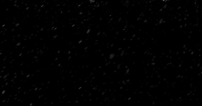 Slow Motion Footage of Falling Realistic Snow Captured on a Pure Black Background. Perfect as a VFX or Compositing Overlay for Winter Atmospheres, Transitions, and Visual Effects.