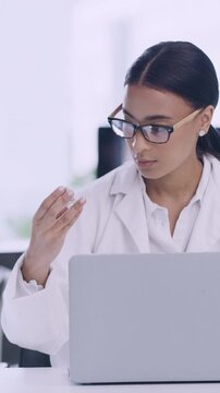 Laptop, woman and scientist with sample in laboratory for medical research, project or study. Medicine innovation, computer and pathologist with vaccine for pharmaceutical development with report.