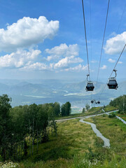 Aerial view of the mountain valley and the village of Manzherok from the funicular, Altai, Russia