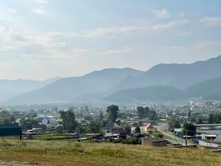 Village at the foot of the green hill, Altai, Russia