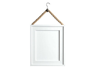 A white rectangular picture frame hangs from a rope and a hook against a stark black background