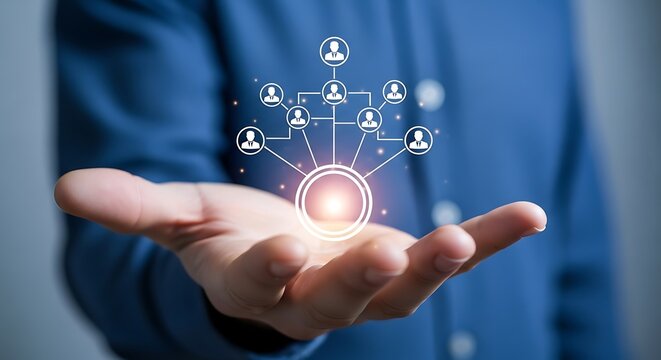 Businessman holding a glowing digital network diagram representing human resource management organizational structure and team connection concepts above his open palm