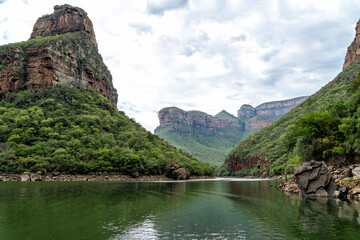 Boattrip on the Blyde River.   Low angle view from the Blyde River Canyon and the Three Rondavels, both part of the famous Panorama Route in South Africa, from a boat.