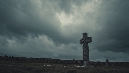 Ancient Irish cross with a weathered surface under a gray overcast sky, highlighting erosion risk