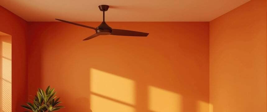 Ceiling fan installed in a room painted orange